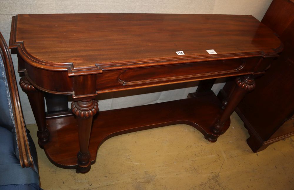 A Victorian mahogany side table, moulded frieze drawer, on bun feet with brass and porcelain castors, W.136cm, D.41cm, H.78cm